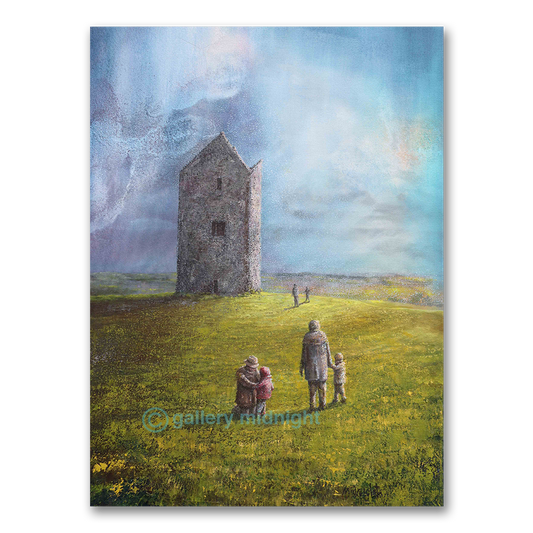 The favous Dovecot stone tower in Bruton stands alone with family walking towards it on a grassy field with a blue sky.