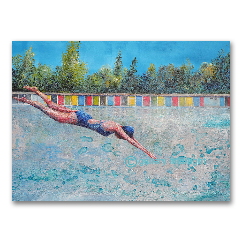 Swimmer in a blue costume diving into Tooting Bec Lido, colourful changing cabins and trees behind under a bright blue sky