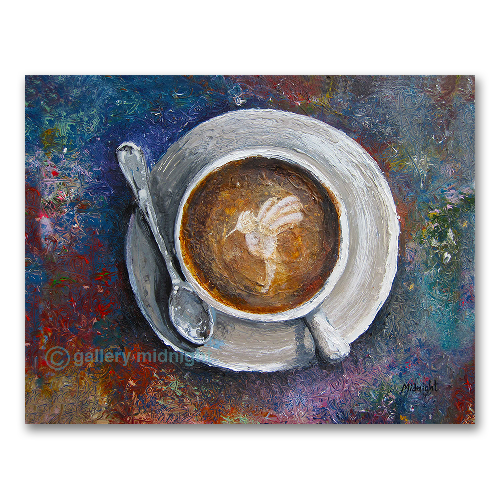 looking down on a coffee cup with image of humming bird on the top