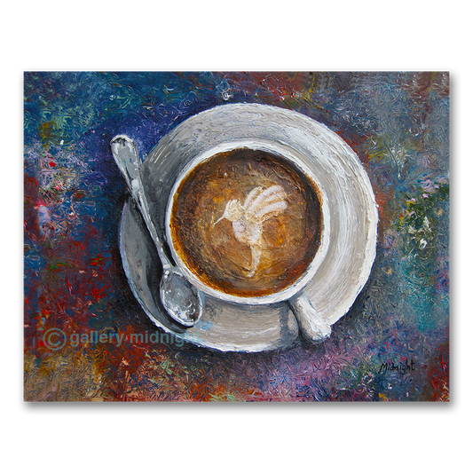 looking down on a coffee cup with image of humming bird on the top